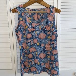 Summery floral sleeveless blouse with ruffled neckline and sleeves. Size large